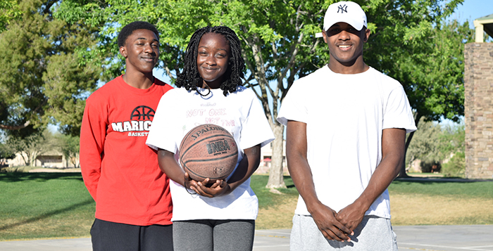 Three of the seven Johnson siblings, Josh, Jayla and Johnny Jr. all played basketball for Maricopa High School this year. Johnny is set to graduate in May. Photo by Michelle Chance