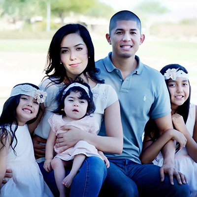 Brielle Macedo sits on the lap of her mother Kim, in a family photo with father Javier and older sisters Bella (left) and Ashley. Submitted photo