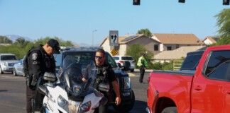 Three MPD officers seen responding to a pedestrian versus car accident on June 7, 2023. [Brian Petersheim Jr.]