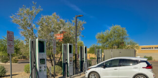 A Chevrolet Bolt sits in front of a row of electric vehicle charging stations in this undated photo. [Courtesy of Arizona Department of Transportation]