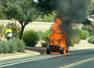 A flame throwing lawn mower in Rancho El Dorado. [Victor Moreno]