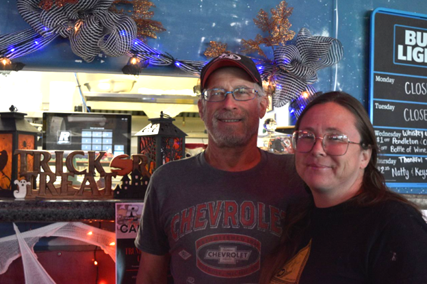 Shawn and Christina Smith stand inside Raceway Bar and Grill Oct. 23, 2023. [Elias Weiss]