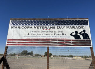 A billboard on John Wayne Parkway near Farrell Road promotes Saturday's parade. [Elias Weiss]