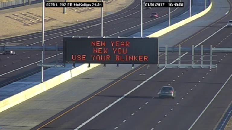 An electronic highway sign on eastbound Loop 202 reads 