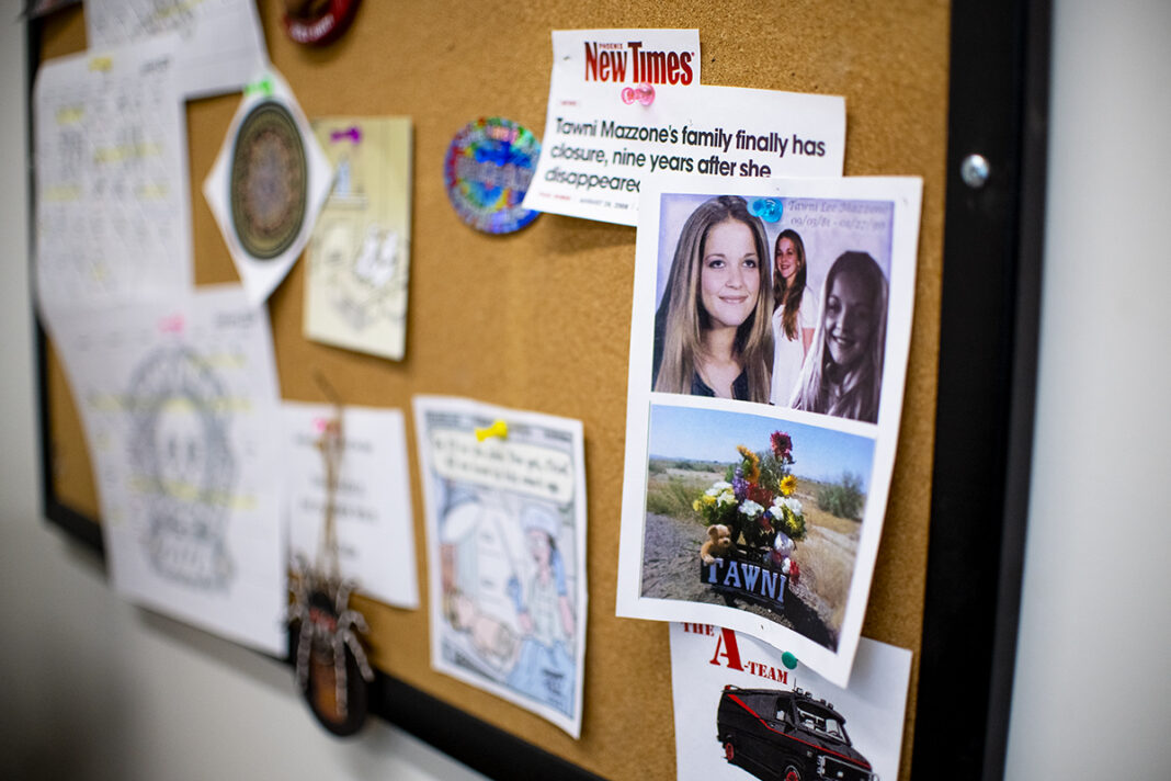 Photos, news headlines and other memorabilia are pinned to a board in Senior Medicolegal Investigator Suzi Dodt's office at the Pinal County Medical Examiner in Florence on Feb. 6, 2024. [Monica D. Spencer]