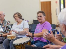 Lizz Fiedorczyk instructs a drum circle at Maricopa Community Center April 22, 2024. [Brian Petersheim Jr.]