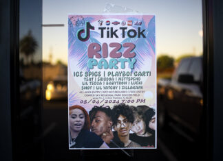 One of several flyers for a "TikTok rizz party" is taped to a door in the Maricopa Business Center along Honeycutt Road on April 23, 2024. [Monica D. Spencer]